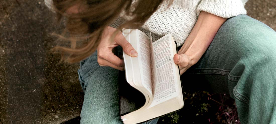 A person reading a book

Description automatically generated