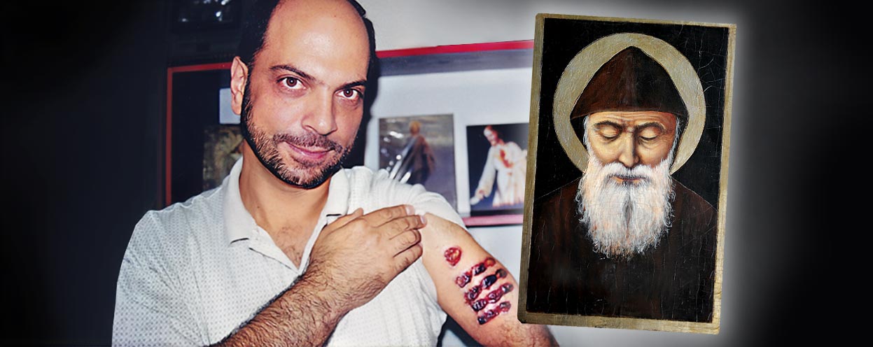 A person with a beard and a white beard

Description automatically generated