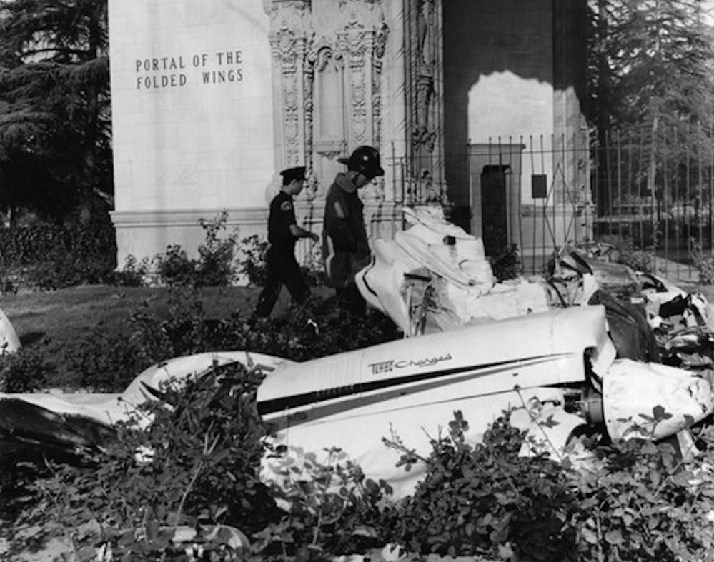 A police officers walking past a crashed car AI-generated content may be incorrect.